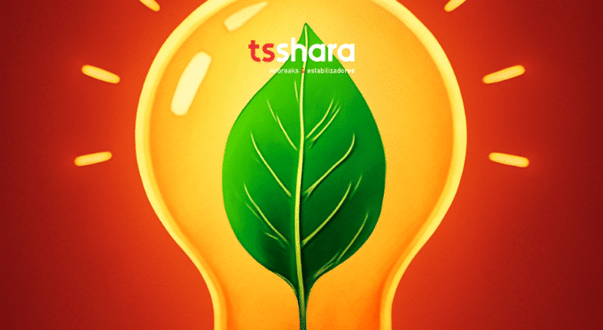 A imagem mostra uma lâmpada acesa com um fundo laranja vibrante. Dentro da lâmpada, há uma folha verde que simboliza sustentabilidade e energia renovável. O logo da TS Shara está posicionado na parte superior central da imagem, com uma tipografia clara e moderna.